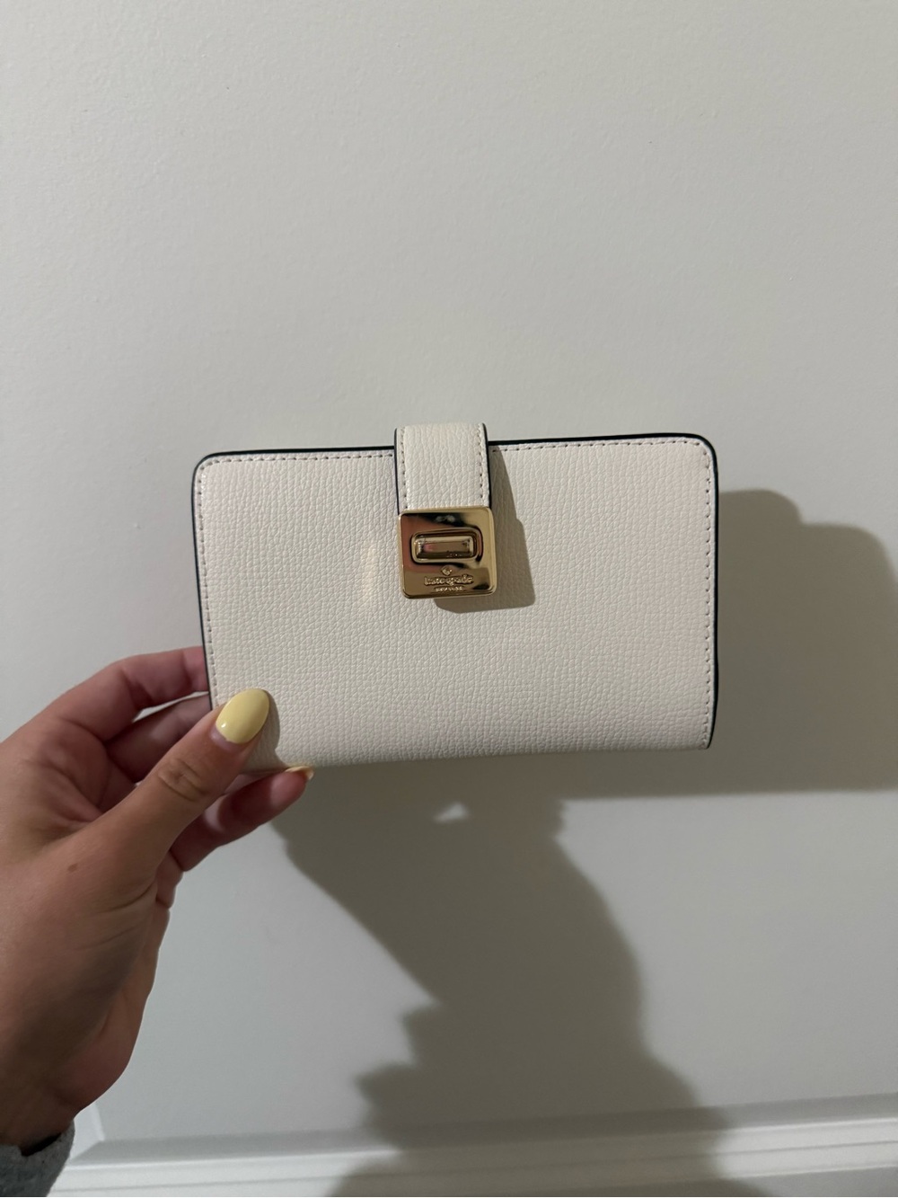 kate spade Cream Pebbled Leather Wallet with Gold Lock